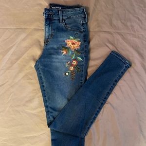 old navy blue denim jeans with flowers on side